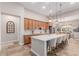 Kitchen island with bar seating and stainless appliances at 9369 W Via Montoya Dr, Peoria, AZ 85383
