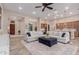 Spacious living area with an open layout, seamlessly connecting to the kitchen and dining areas at 9369 W Via Montoya Dr, Peoria, AZ 85383