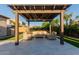 Inviting outdoor seating area with a pergola, comfortable furniture, and elegant stone flooring at 9369 W Via Montoya Dr, Peoria, AZ 85383