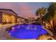 Stunning backyard pool area with a waterfall, pergola, and outdoor living spaces for entertaining at 9369 W Via Montoya Dr, Peoria, AZ 85383