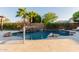 Beautiful pool area with rock accents, a waterfall, and a spacious deck perfect for entertaining at 9369 W Via Montoya Dr, Peoria, AZ 85383