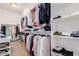 A spacious walk-in closet featuring custom shelving for shoes and accessories at 9369 W Via Montoya Dr, Peoria, AZ 85383