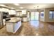 Modern kitchen featuring white cabinets, granite countertops, and stainless steel appliances at 10031 W Hess St, Tolleson, AZ 85353