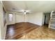 Spacious living room with hardwood flooring, ceiling fan, and neutral paint at 10031 W Hess St, Tolleson, AZ 85353