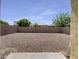 Spacious backyard with gravel and perimeter wall, ready for customization at 10531 E Nopal Ave, Mesa, AZ 85209