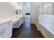 Bright bathroom with a double vanity, soaking tub, and a separate shower at 10531 E Nopal Ave, Mesa, AZ 85209