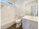 Clean bathroom with a shower-tub combo, white cabinetry, and tile floors at 10531 E Nopal Ave, Mesa, AZ 85209