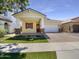 Charming single-Gathering home with a well-manicured front yard and a two-car garage at 10531 E Nopal Ave, Mesa, AZ 85209