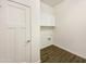 Laundry room with built-in cabinets and tile floors, ready for appliances at 10531 E Nopal Ave, Mesa, AZ 85209