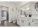 Clean bathroom featuring white cabinetry, modern fixtures, and a neutral color scheme at 11008 N 165Th Ave, Surprise, AZ 85388