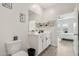 Bright bathroom featuring modern fixtures, a white vanity, and sleek black hardware accents at 11008 N 165Th Ave, Surprise, AZ 85388
