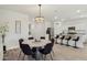 Open-concept layout featuring a dining area adjacent to a modern kitchen with stainless steel appliances at 11008 N 165Th Ave, Surprise, AZ 85388