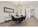 Bright dining room with modern lighting, stylish decor, and wood-look flooring at 11008 N 165Th Ave, Surprise, AZ 85388