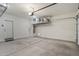 Spacious garage with ample storage solutions and clean concrete flooring, ready for vehicles at 11008 N 165Th Ave, Surprise, AZ 85388