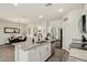 Modern kitchen featuring granite countertops, stainless steel appliances, and seamless flow to dining area at 11008 N 165Th Ave, Surprise, AZ 85388