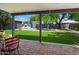 Large backyard with lush lawn, brick patio, and an outdoor grill at 1106 W Glenrosa Ave, Phoenix, AZ 85013