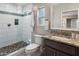 Modern bathroom featuring a glass shower with tile surround and granite vanity at 1106 W Glenrosa Ave, Phoenix, AZ 85013