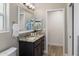 This bathroom features a sleek vanity with granite countertops and a modern mirror at 1106 W Glenrosa Ave, Phoenix, AZ 85013