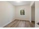 Bright bedroom with light wood flooring and a large window at 1106 W Glenrosa Ave, Phoenix, AZ 85013