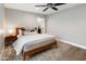 Neutral bedroom featuring light gray walls, hardwood floors, and a ceiling fan at 1106 W Glenrosa Ave, Phoenix, AZ 85013