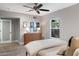 Serene bedroom with light gray walls, natural light, and a ceiling fan at 1106 W Glenrosa Ave, Phoenix, AZ 85013