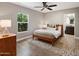 Cozy bedroom with a window view, hardwood floors, and a simple yet stylish bed at 1106 W Glenrosa Ave, Phoenix, AZ 85013