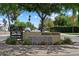 Street view of the Woodlea Melrose neighborhood entrance sign under a canopy of trees at 1106 W Glenrosa Ave, Phoenix, AZ 85013