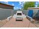Outdoor fireplace with white and blue tiling, plus brick patio and table, great for backyard entertaining at 1106 W Glenrosa Ave, Phoenix, AZ 85013