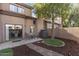 Cozy backyard with landscaped garden and outdoor seating area at 1114 W Windjammer Dr, Gilbert, AZ 85233
