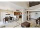 Open-concept dining area with a modern chandelier, seamlessly connected to the kitchen for easy entertaining at 1114 W Windjammer Dr, Gilbert, AZ 85233