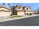 Charming townhome showcasing desert landscaping and a private two-car garage for convenient parking at 1114 W Windjammer Dr, Gilbert, AZ 85233