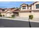 Attractive townhome with well-maintained landscaping, tile roof, and attached garages, offering a comfortable living experience at 1114 W Windjammer Dr, Gilbert, AZ 85233