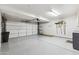 Spacious garage with ample room for parking and storage, featuring a clean epoxy floor and organization solutions at 1114 W Windjammer Dr, Gilbert, AZ 85233