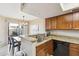 Efficient kitchen featuring granite countertops and stainless steel sink at 1114 W Windjammer Dr, Gilbert, AZ 85233