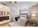 Comfortable bedroom featuring an en-suite bathroom with double sinks at 1114 W Windjammer Dr, Gilbert, AZ 85233