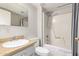 Cozy bathroom with a shower-tub combo, a white toilet, and a vanity with wood-look countertops at 1217 N Miller Rd # 32, Scottsdale, AZ 85257