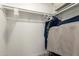 Walk-in closet with multiple hanging racks, shelving, and ample storage space at 1217 N Miller Rd # 32, Scottsdale, AZ 85257