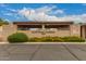 Community entrance to Scottsdale Gardens with visitor parking and well-maintained landscaping at 1217 N Miller Rd # 32, Scottsdale, AZ 85257