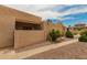 Charming exterior view of the property with a well-kept garden and desert landscaping at 1217 N Miller Rd # 32, Scottsdale, AZ 85257