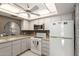 Efficient kitchen layout with ample storage, modern appliances, and neutral countertops at 1217 N Miller Rd # 32, Scottsdale, AZ 85257