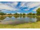 Scenic pond with serene views, surrounded by lush greenery, perfect for relaxation and recreation at 1217 N Miller Rd # 32, Scottsdale, AZ 85257