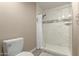 Beautiful shower is highlighted by white tile and a decorative accent strip at 1217 N Miller Rd # 32, Scottsdale, AZ 85257