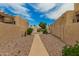 Exterior walkway with desert landscaping leading to condo units provides a serene environment at 1217 N Miller Rd # 32, Scottsdale, AZ 85257