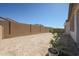 Large backyard enclosed by block wall offering ample space for outdoor activities at 12316 W Wagon Wheel Dr, Glendale, AZ 85307