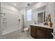 Bright bathroom with tile flooring, a vanity, and a shower-tub combination at 12316 W Wagon Wheel Dr, Glendale, AZ 85307