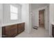 Bathroom featuring vanity with counter, storage, and a glass enclosed shower at 12316 W Wagon Wheel Dr, Glendale, AZ 85307