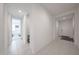 Hallway with tile flooring and open view into a bedroom at 12316 W Wagon Wheel Dr, Glendale, AZ 85307
