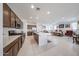 Spacious kitchen featuring stainless steel appliances and a large island with a view into the living area at 12316 W Wagon Wheel Dr, Glendale, AZ 85307