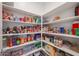 Well-stocked pantry with ample shelving and storage space for food and household items at 12316 W Wagon Wheel Dr, Glendale, AZ 85307