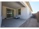 Covered patio with concrete floor and sliding glass door overlooks the backyard at 12316 W Wagon Wheel Dr, Glendale, AZ 85307
